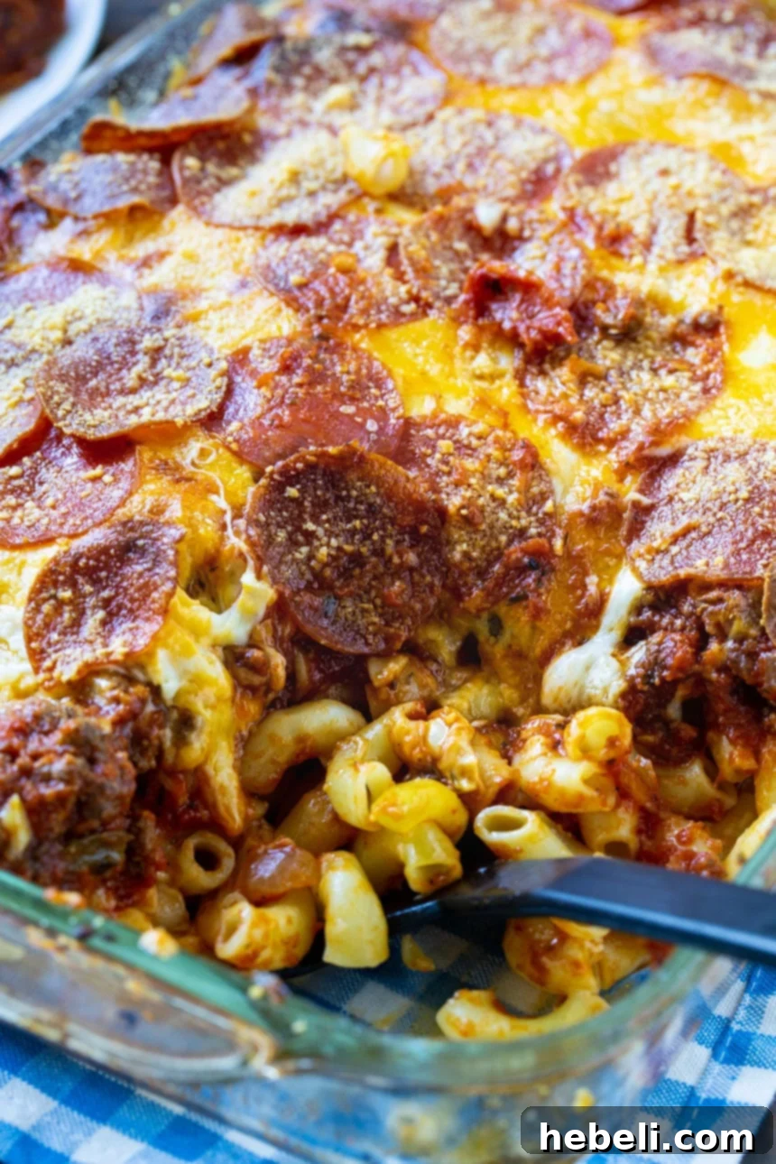 Johnny Marzetti Casserole being scooped up with spoon.