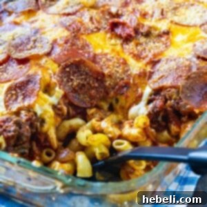 Casserole in baking dish with a spoon scooping a serving.