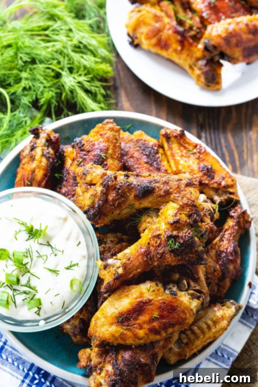 Ranch Wings on a plate with bowl of Ranch dressing.