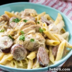 Chicken Alfredo in a blue bowl.