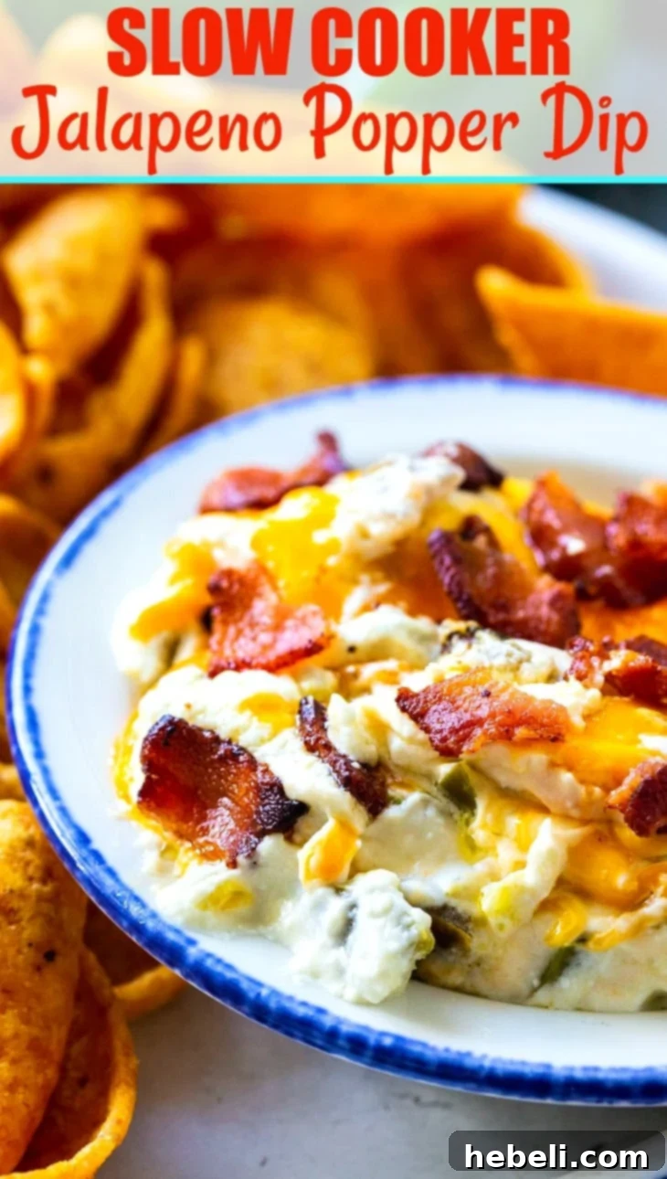 Ultimate Slow Cooker Jalapeno Popper Dip 6 Beautifully garnished Slow Cooker Jalapeno Popper Dip in a serving bowl, showcasing its rich texture and inviting warmth.