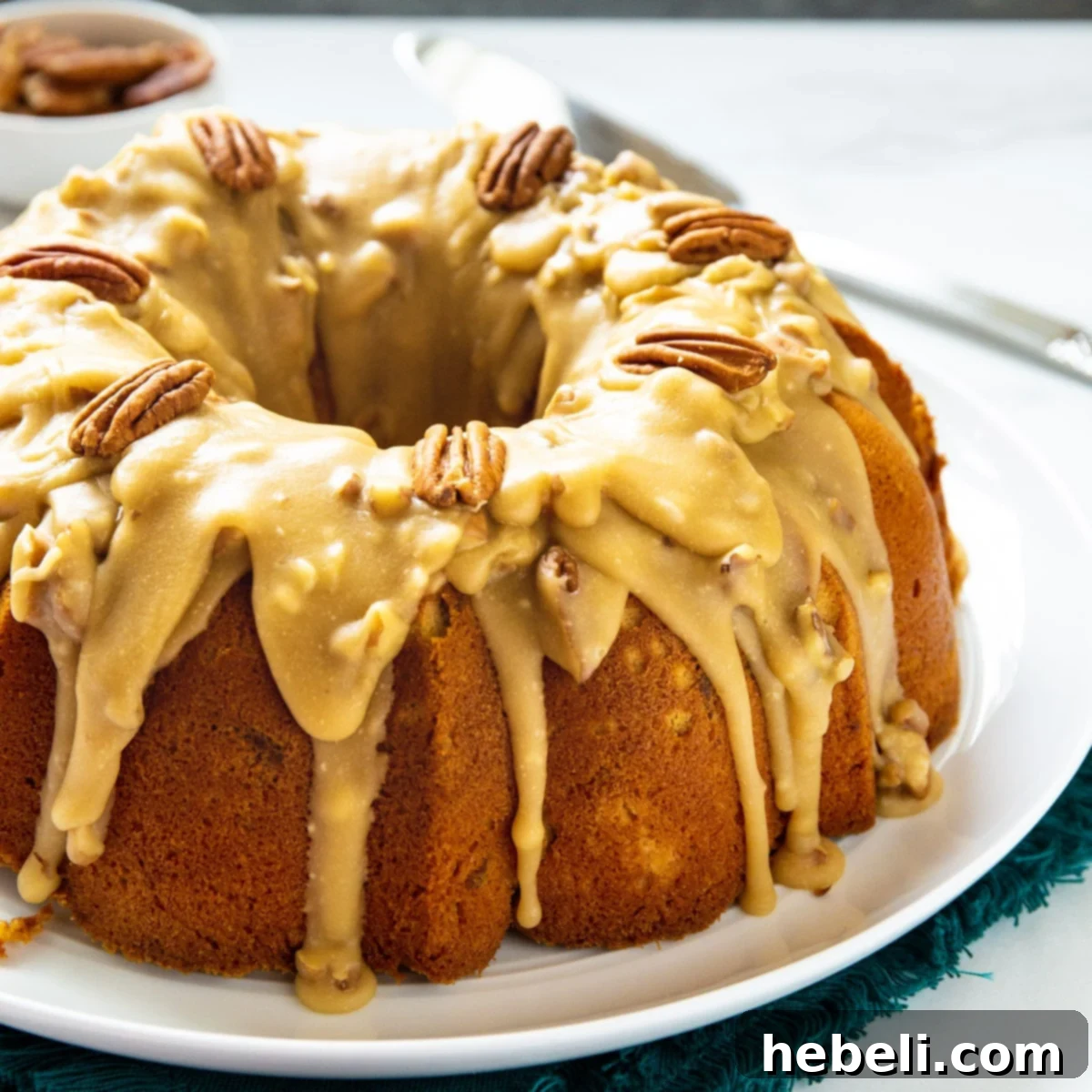 Southern Pecan Praline Bundt Delight 2 Southern Praline Bundt Cake topped with a glistening praline glaze and whole pecans.