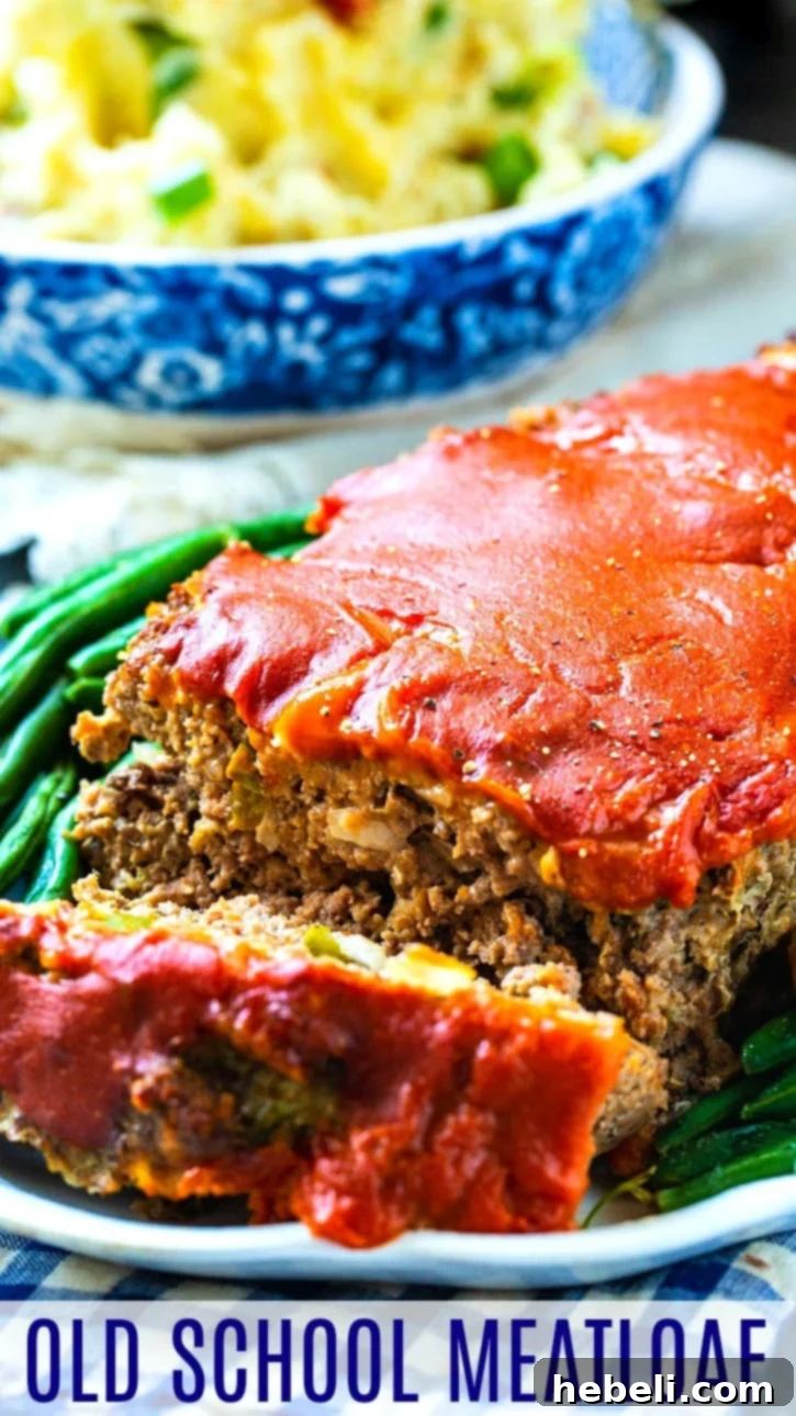 Classic Homestyle Meatloaf 6 Old School Meatloaf, beautifully glazed and ready to serve, featuring the vibrant green pepper and onion visible in its tender texture.