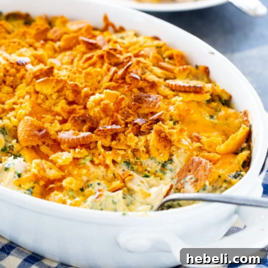 Effortless Chicken Spinach Bake 2 Delicious Easy Chicken and Spinach Casserole in an oval baking dish, ready to be served.