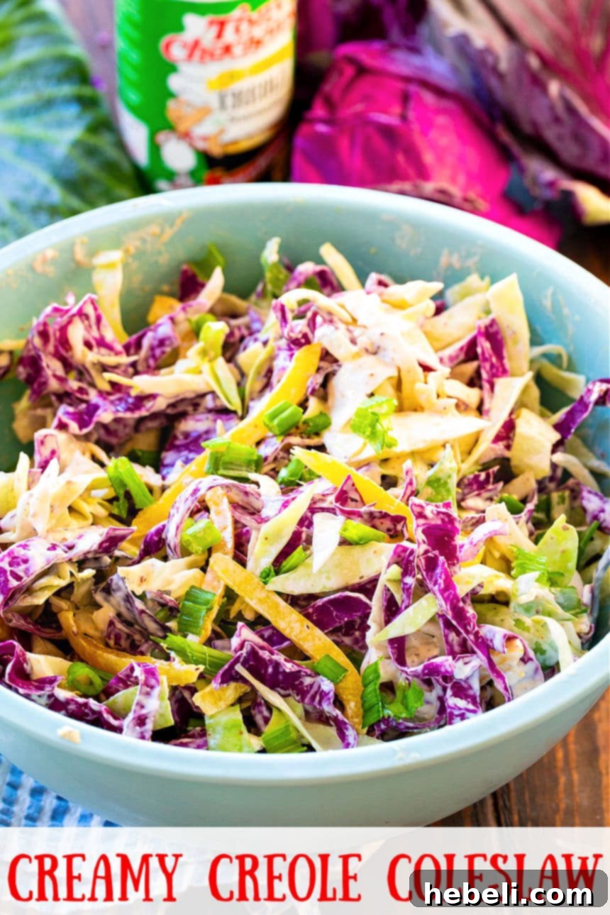 Zesty Creole Coleslaw 6 Close-up of Creamy Creole Coleslaw in a blue bowl, showing texture and vibrant colors.
