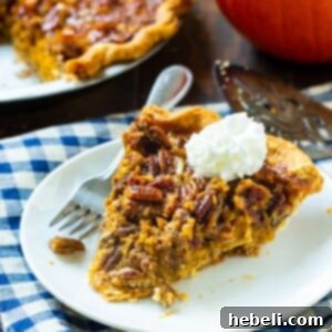 Slice of pie on a white plate with whipped cream.