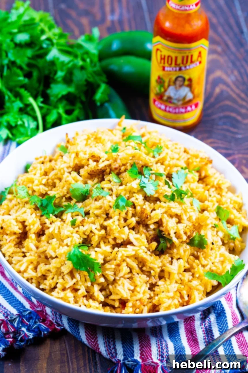 Perfect Mexican Rice in a white bowl, ready to be served, highlighting its inviting appearance.