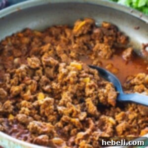 Taco Meat simmering in a skillet, ready to be served.
