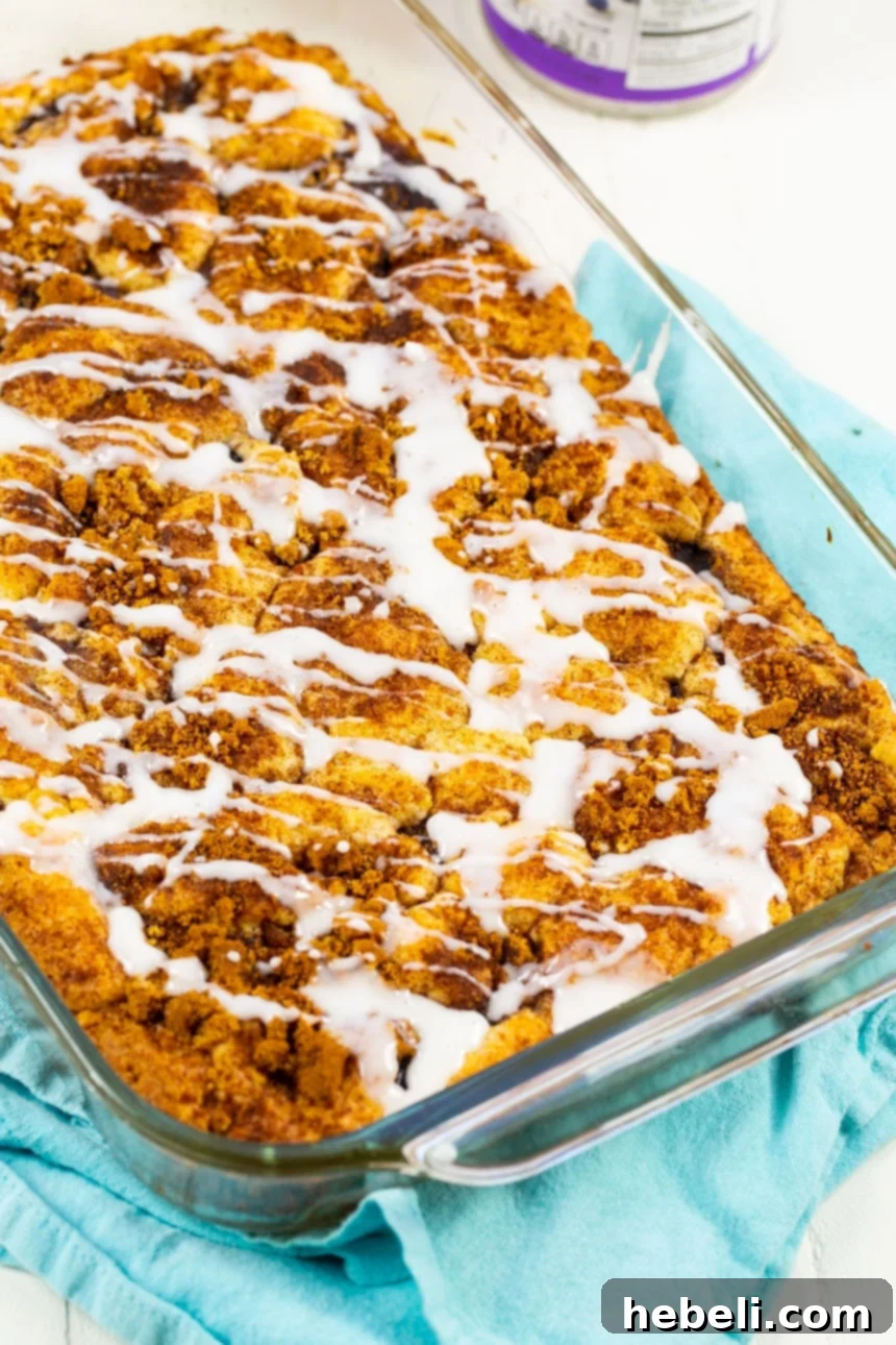 Blueberry Pie Coffee Cake Perfection 3 Easy Blueberry Pie Coffee Cake baking in a 9x13-inch pan, showcasing its bubbling blueberry filling and cinnamon-brown sugar topping achieving a golden crust.