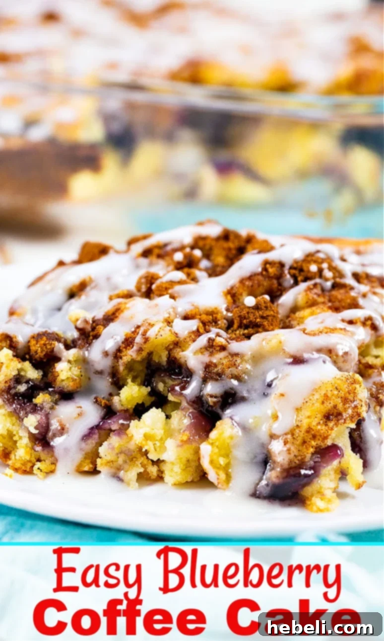 Blueberry Pie Coffee Cake Perfection 5 Beautifully baked Blueberry Pie Coffee Cake, showcasing its golden crust, luscious blueberry filling, and inviting streusel topping, sliced and ready to serve.