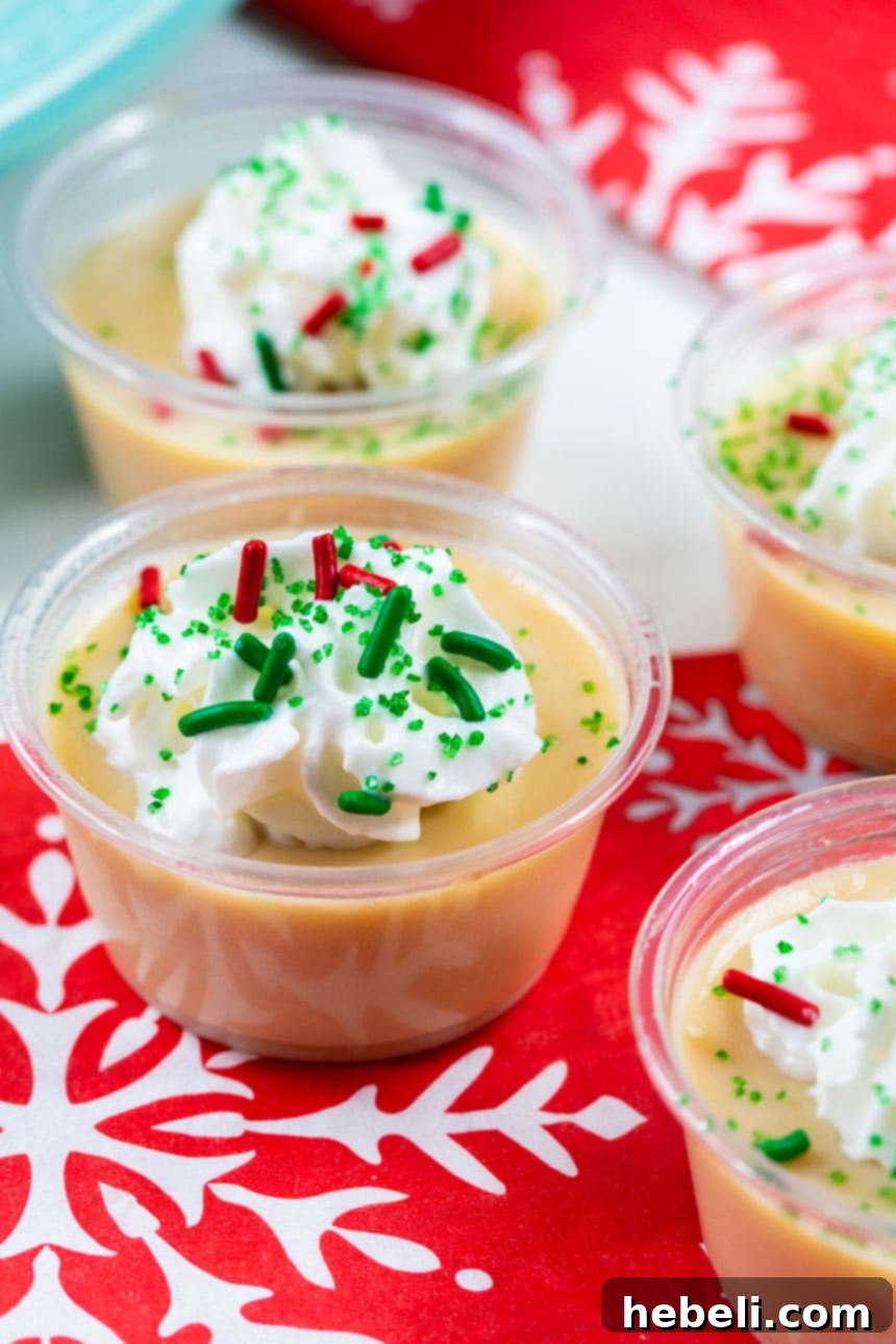Sugar Cookie Jello Shots elegantly displayed on a red snowflake napkin.