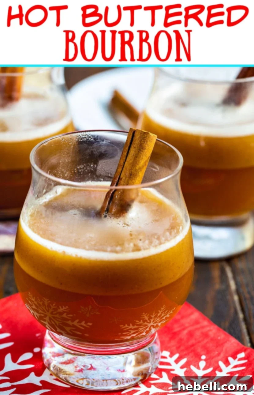 Close-up of Hot Buttered Bourbon garnished with a cinnamon stick, ready to be enjoyed.