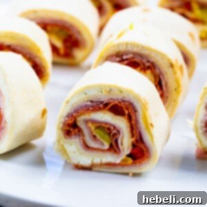 Sliced Spicy Italian Pinwheels on a serving plate.