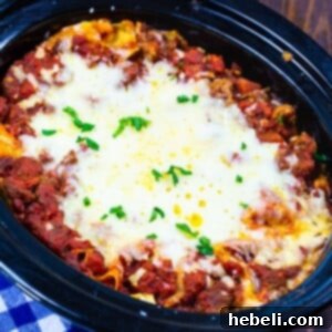 Sausage Lasagna in a black slow cooker.
