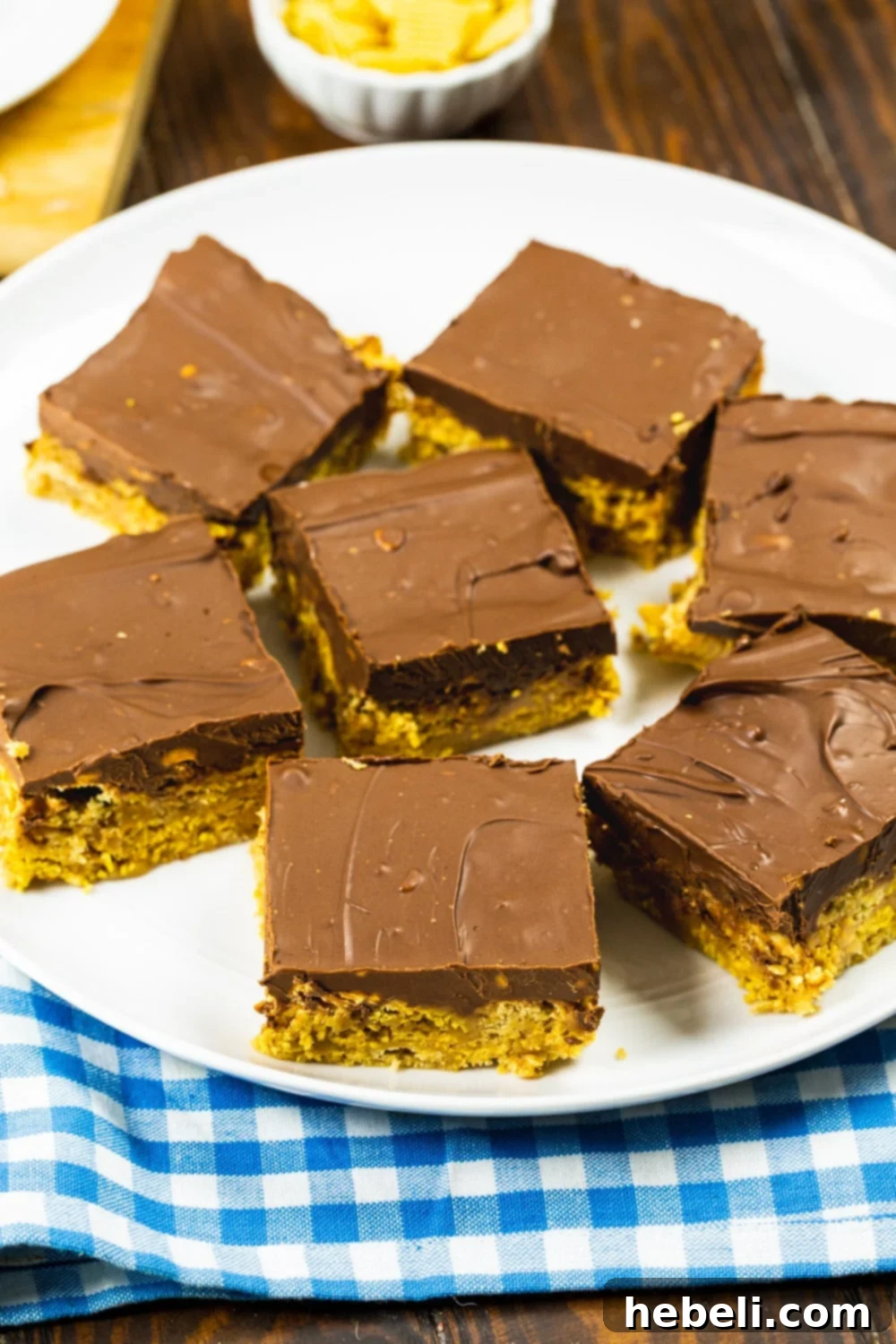 Close-up of freshly cut Scotcharoo squares, showcasing their distinct layers of crunchy base and smooth chocolate-butterscotch topping.