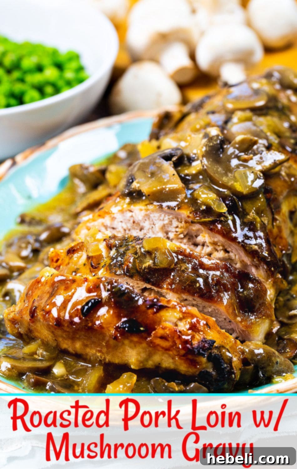 Close-up of a perfectly roasted pork loin, beautifully sliced to reveal its tender, juicy interior, ready for serving with the creamy mushroom gravy.