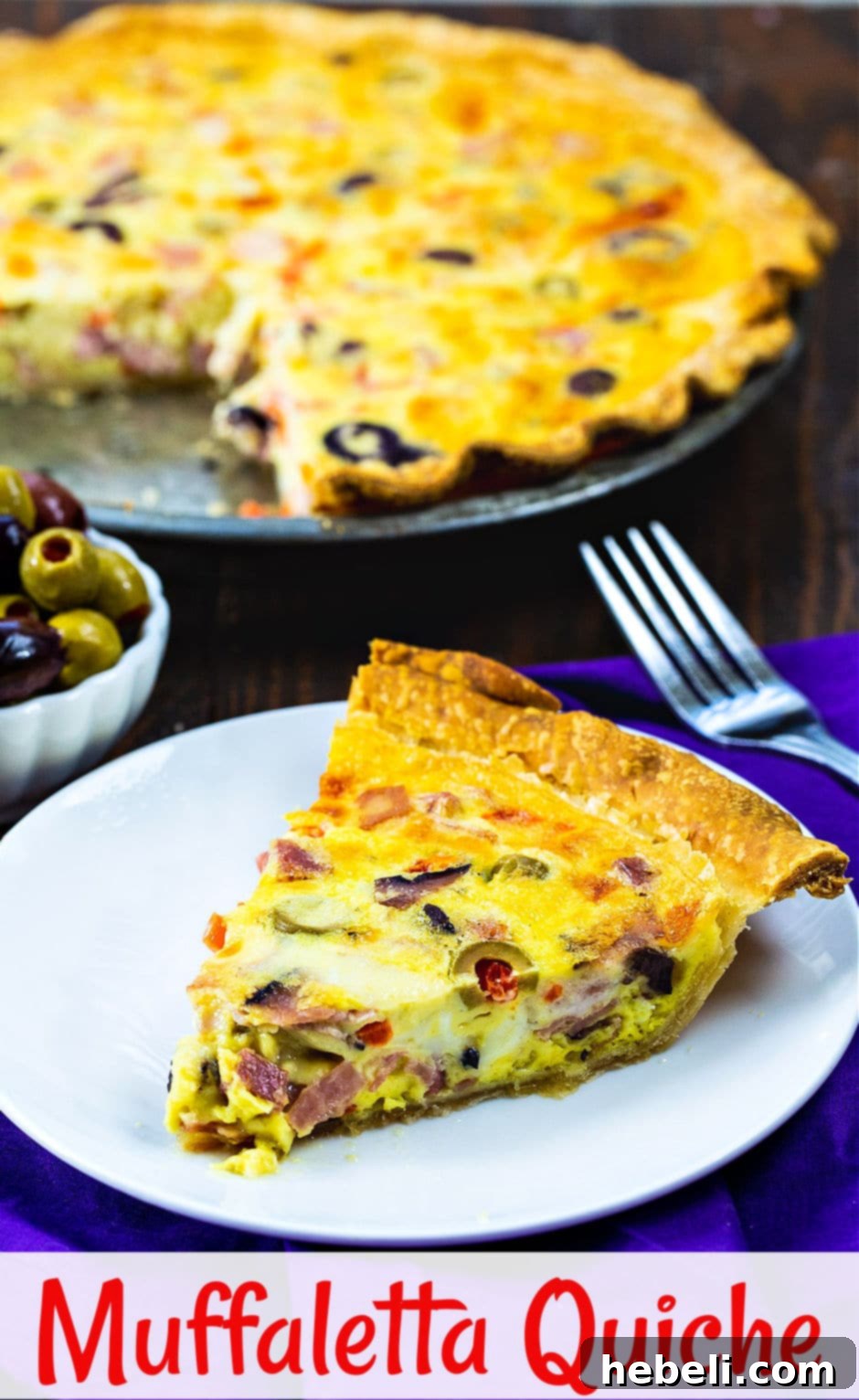 Savory Muffaletta Quiche 6 Overhead shot of a full Muffaletta Quiche with visible olives, meats, and a perfectly golden-brown crust, ready to be served.