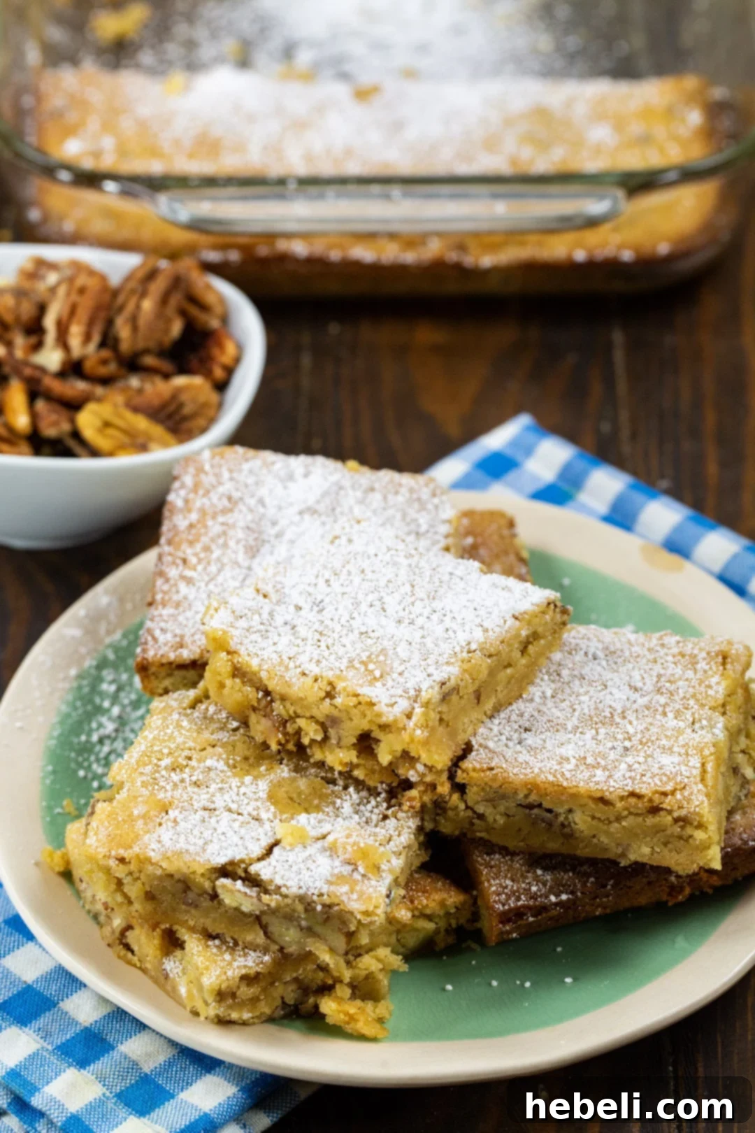 Charleston Chewies on a plate and a bowl of pecans, highlighting the ingredients.