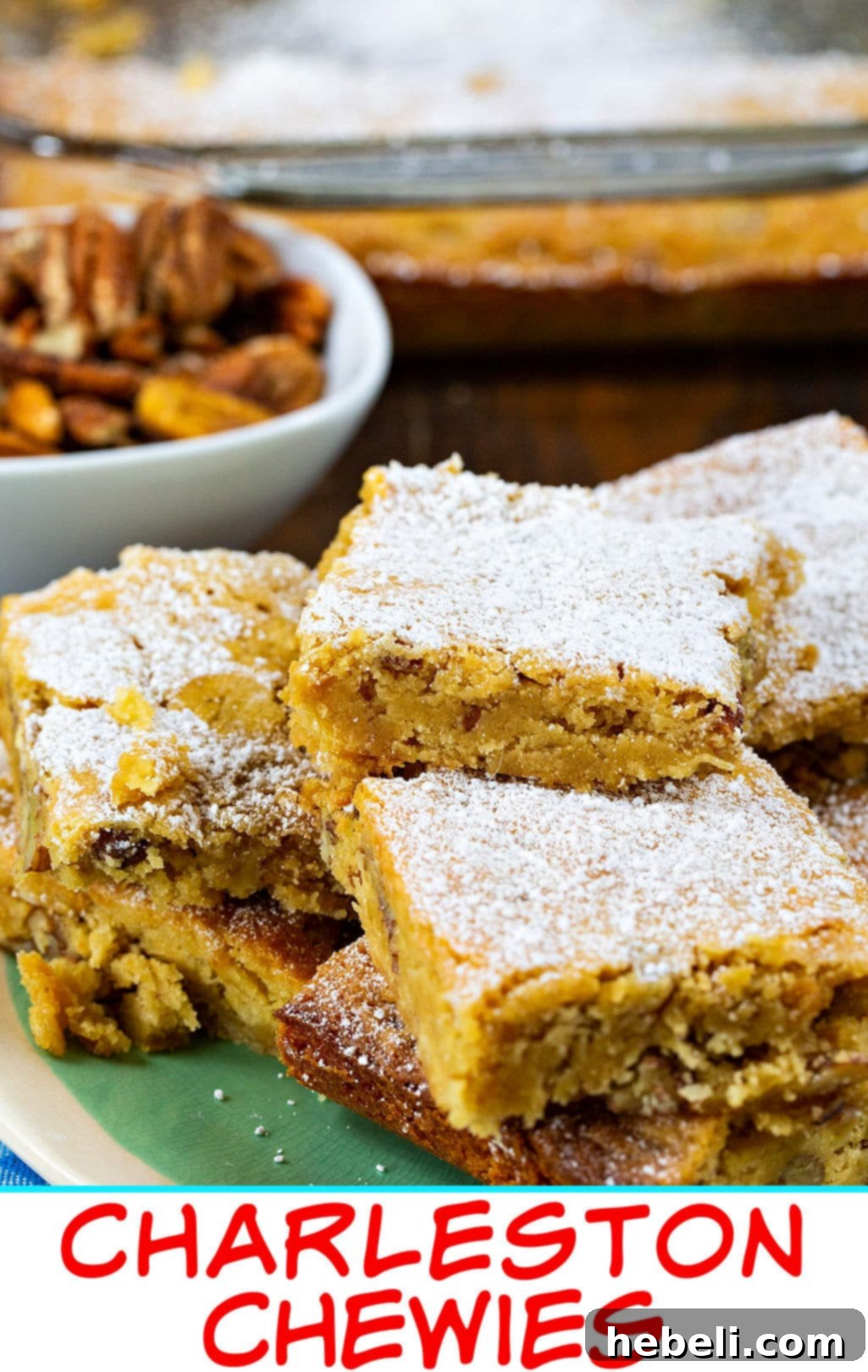 Close-up of a cut Charleston Chewie, showing its dense, chewy texture and visible pecan pieces.