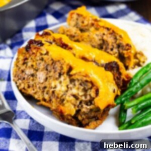 Three slices of Cheesy Chipotle Meatloaf on a plate.