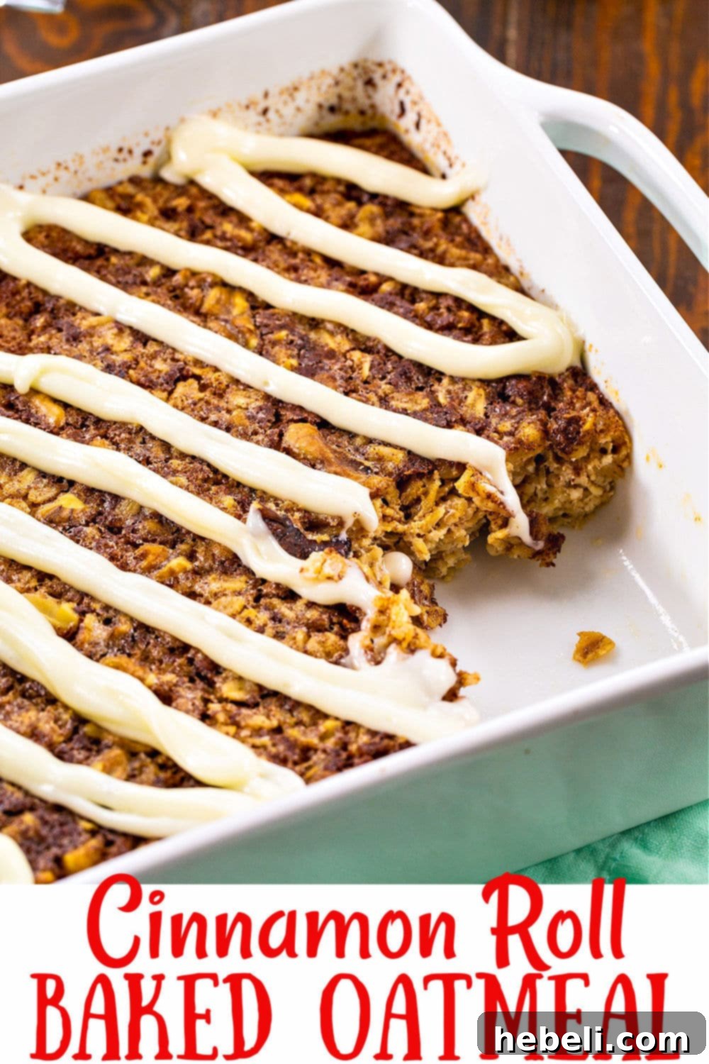 A close-up shot of Cinnamon Roll Baked Oatmeal, showcasing its texture, embedded nuts, and the rich cream cheese glaze pooling invitingly on top.