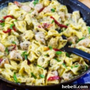 Creamy Pesto Chicken Tortellini in a large skillet.