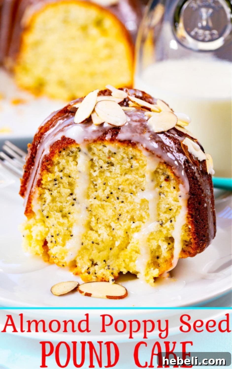 A top-down view of the entire Almond Poppy Seed Pound Cake, beautifully glazed and garnished with toasted sliced almonds.