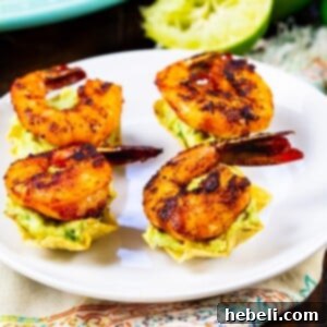 Four Shrimp Tostada Bites on a plate.