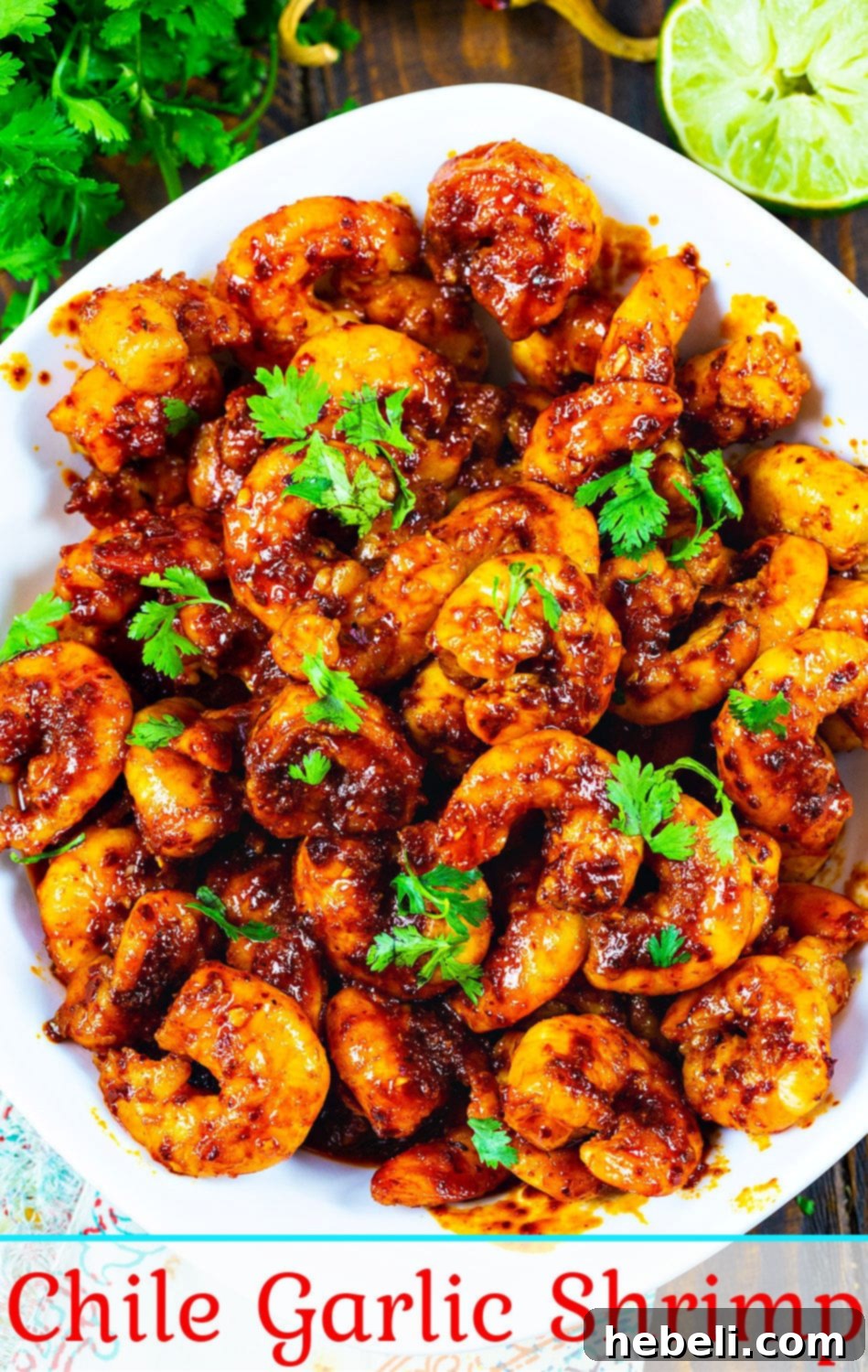 An overhead shot of a single Chile and Garlic Shrimp, glistening with sauce and cilantro, ready to be enjoyed.