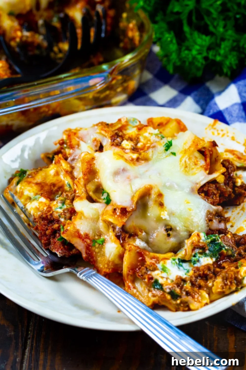 A single serving of Beef Florentine Casserole on a plate, showing the rich ground beef sauce, noodles, and melted cheese, ready to be enjoyed.