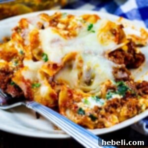 Beef Florentine Casserole dished up on a plate, featuring egg noodles, spinach, ground beef, and melted cheese.