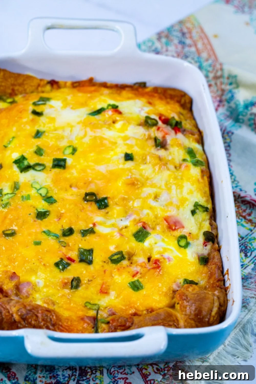 Golden Ham and Cheese Crescent Bake 3 Whole Ham and Cheese Casserole in a baking dish, freshly baked and ready to serve.