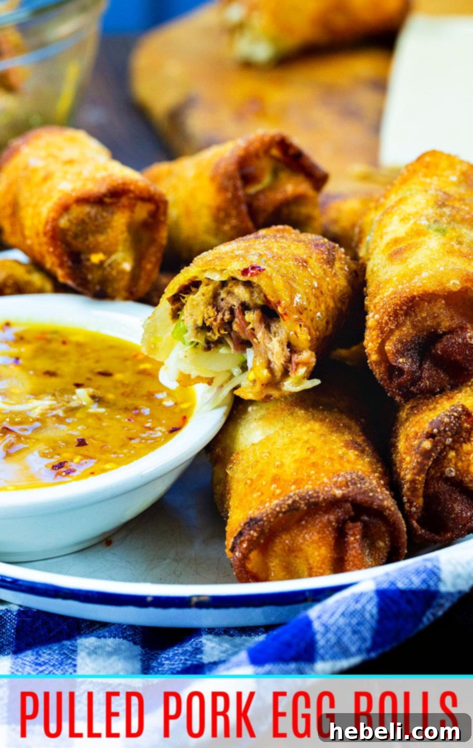 Smoky BBQ Pork Egg Rolls 8 A large serving platter filled with golden-brown Pulled Pork Egg Rolls, showcasing their crispy texture.