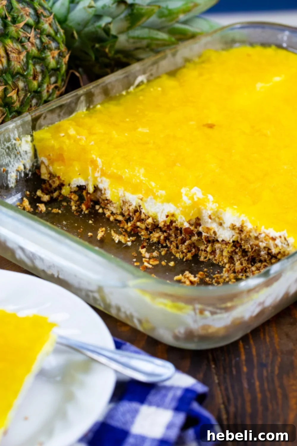 A full 9x13-inch pan of Pineapple Pretzel Salad, ready to be served, displaying its vibrant layers.