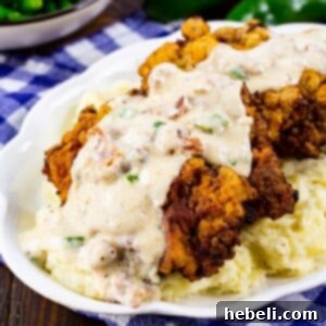Chicken Fried Steak with Jalapeño Bacon Gravy over mashed potatoes.