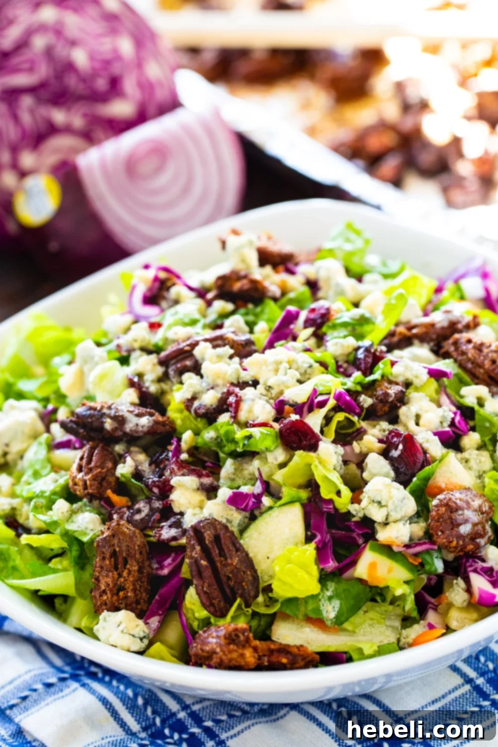 A close-up of the chopped salad ingredients, highlighting the shredded red cabbage and finely diced red onion.