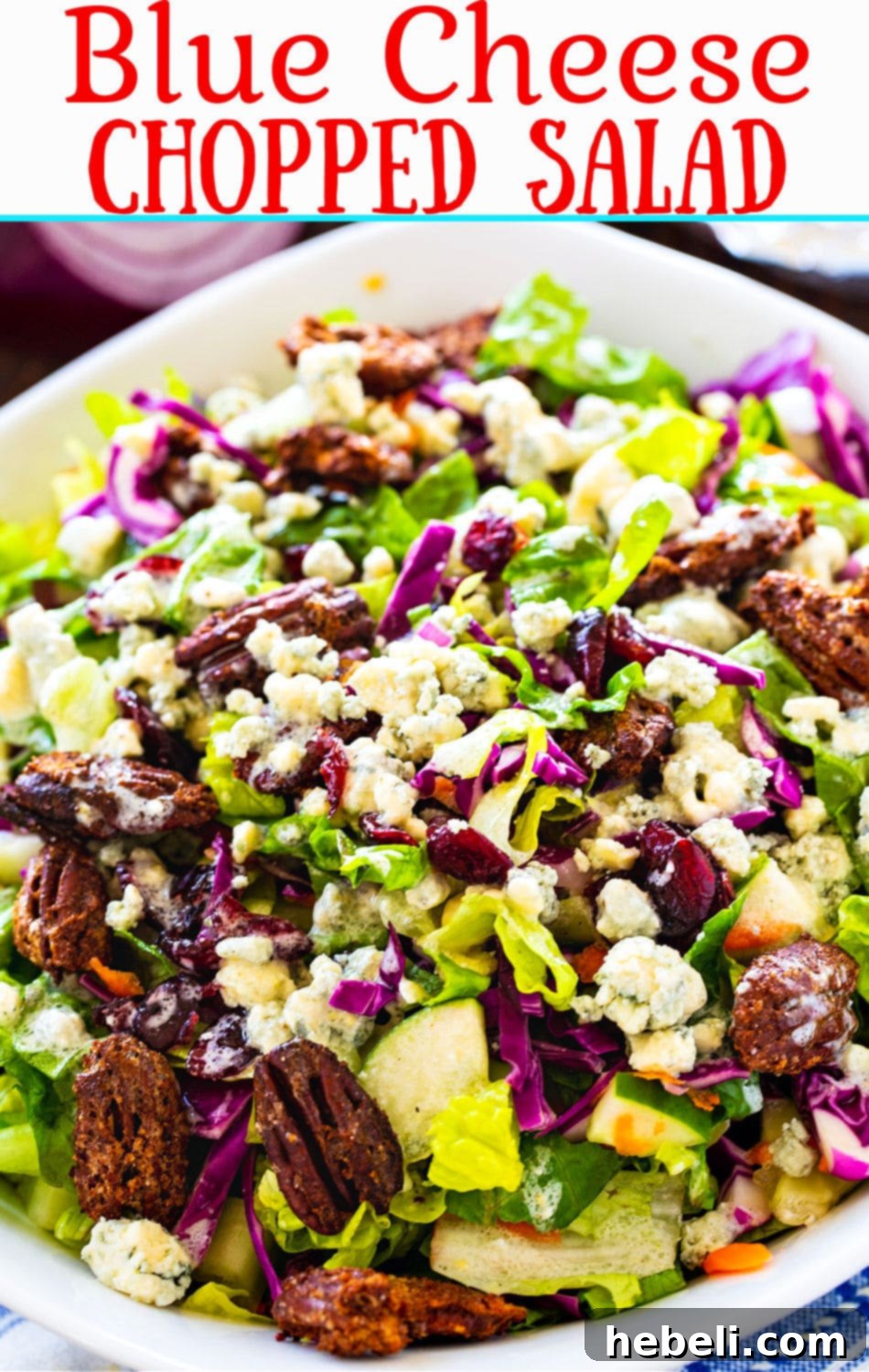 A beautifully presented Blue Cheese Chopped Salad in a modern white bowl, ready for serving.