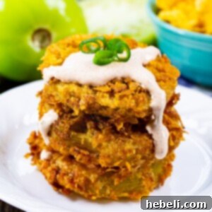 Stack of Cornflake Crusted Fried Green Tomatoes topped with Chipotle Mayo.