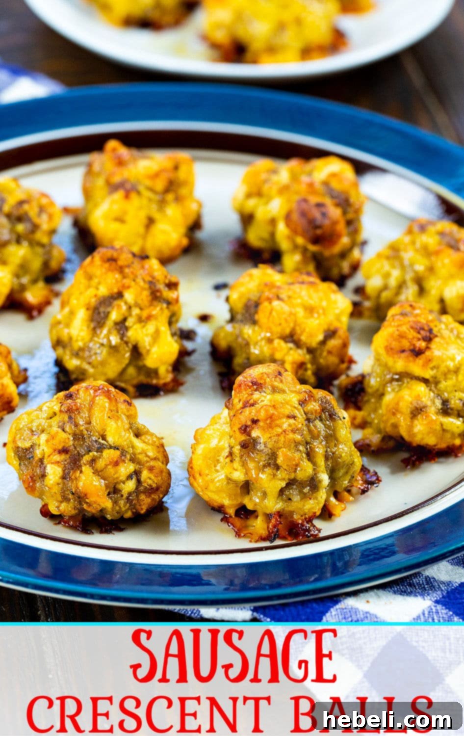 A vibrant close-up of Sausage Crescent Balls on a serving plate, highlighting their golden crust and fluffy interior.