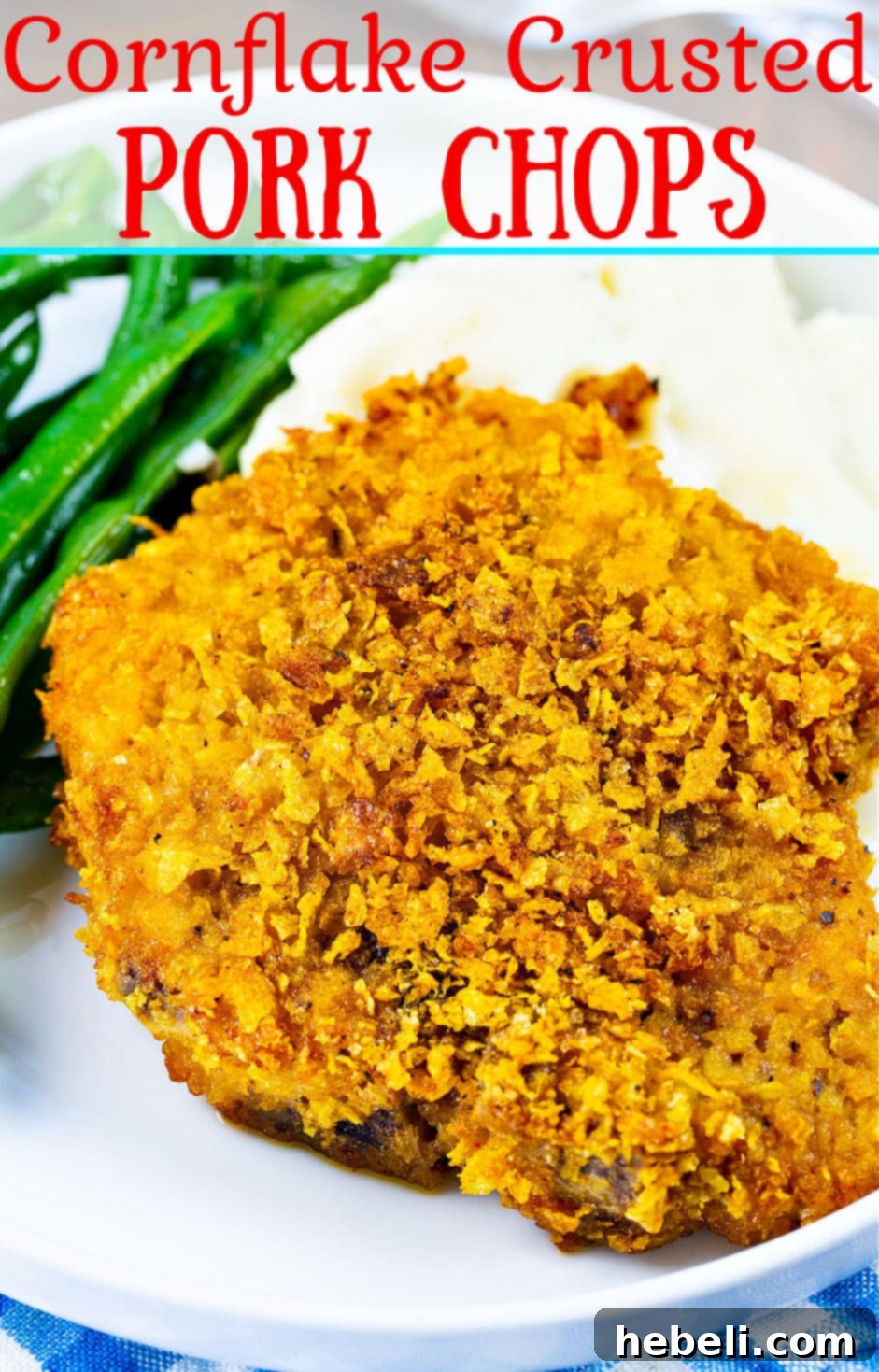A beautifully plated Cornflake Crusted Baked Pork Chop with mashed potatoes and green beans, showcasing the crispy texture and appealing presentation.