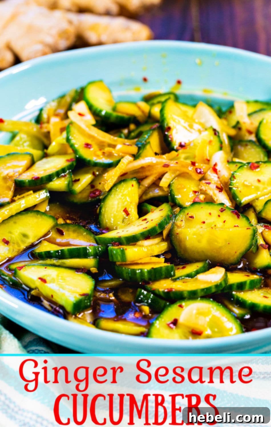 A final, appealing shot of Ginger Sesame Cucumbers, glistening with dressing and ready to be served, emphasizing its fresh and healthy appeal.
