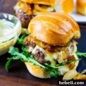 French Onion Burgers on brioche buns with arugula.