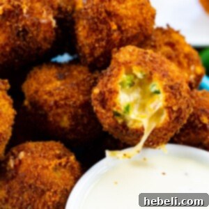 Crispy Jalapeno Poppers 5 Fried Jalapeno Popper Bites with bite bitten out.