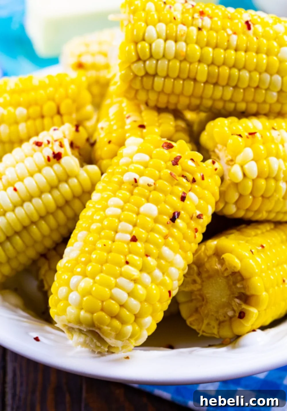 Southern Hot Honey Butter Corn piled high on a white serving plate, ready to be enjoyed