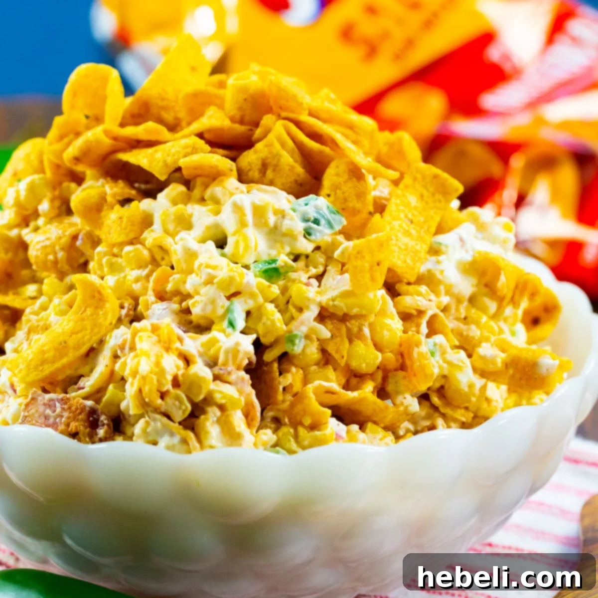 Creamy Jalapeno Frito Corn Salad 2 A vibrant bowl of Jalapeno Popper Corn Frito Salad, showcasing its creamy texture, corn, and crisp Fritos.