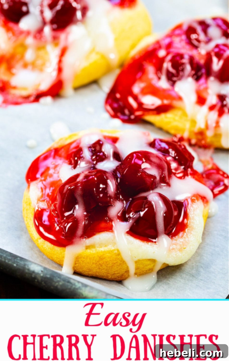 Flaky Cherry Danishes Made Simple 7 Close-up of a single cherry danish, showing its flaky crust, creamy filling, and luscious cherry topping.