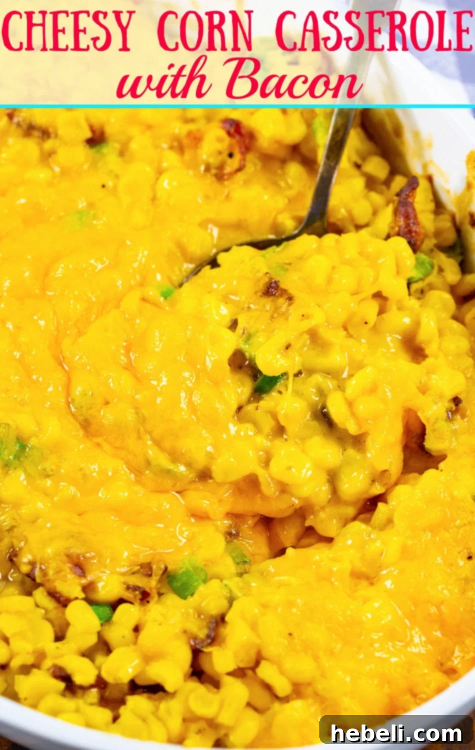 Close-up of baked Cheesy Corn Casserole with Bacon, garnished with fresh green onions and ready for serving.