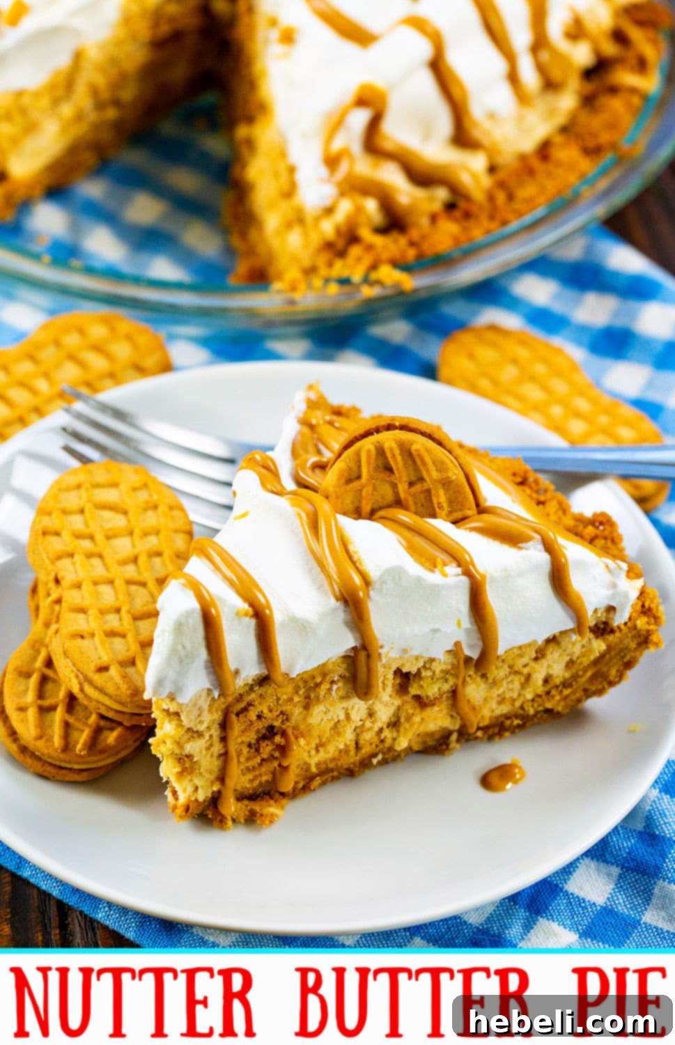 Peanut Butter Bliss Pie 10 Overhead view of a finished Nutter Butter Pie, garnished with whole cookies and a peanut butter drizzle, ready to be sliced and served.