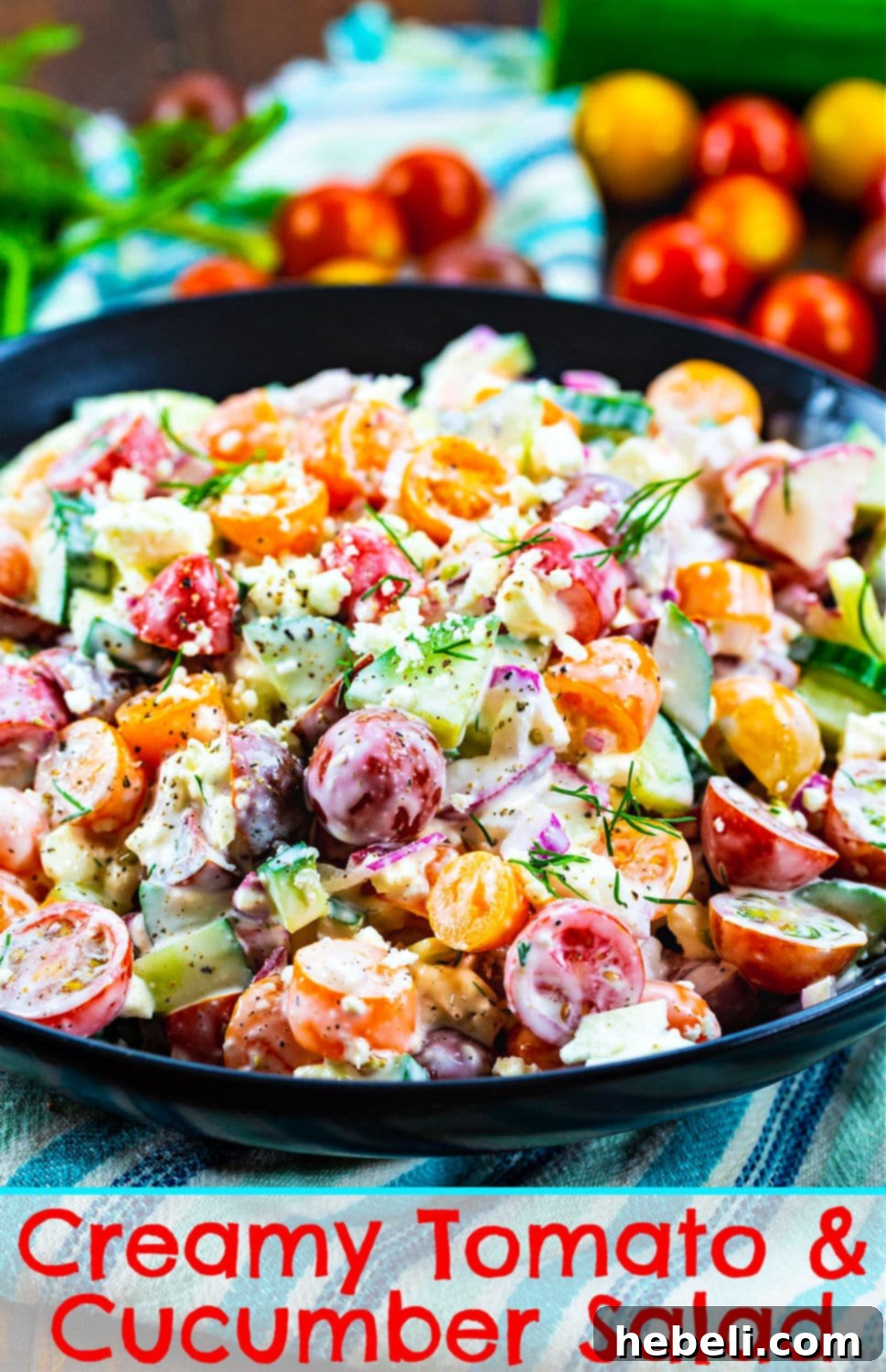 A large serving of Creamy Tomato and Cucumber Chopped Salad with crumbled feta cheese visible on top.