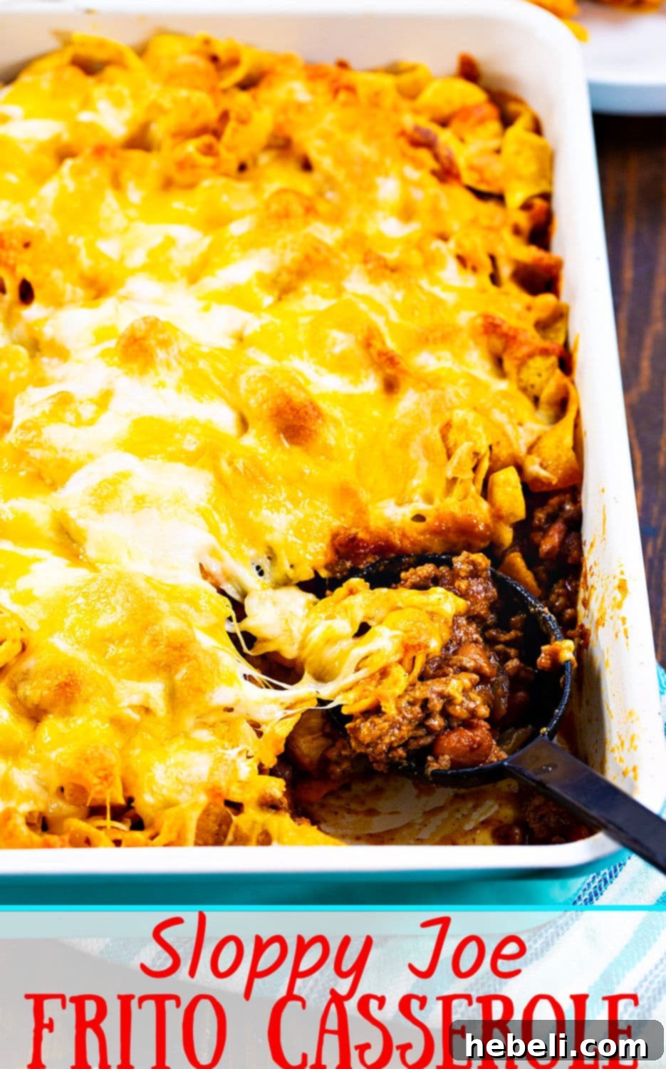 A delicious close-up of Sloppy Joe Frito Casserole, showcasing the golden Fritos and melted, bubbly cheese.